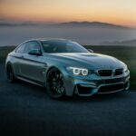 gray mercedes benz coupe on black asphalt road during daytime