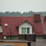 a row of houses with red roof tiles