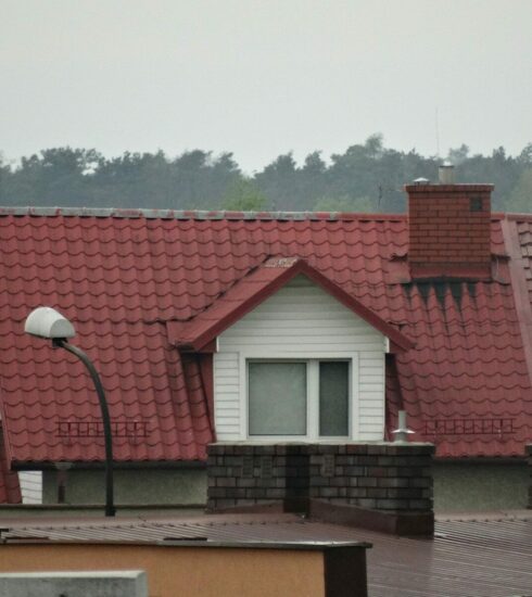 a row of houses with red roof tiles