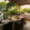Covered patio with seating, hammock, and pool view